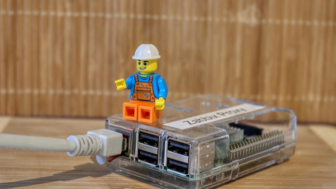 Small green Raspberry Pi single-board computer with visible processor and GPIO pins.