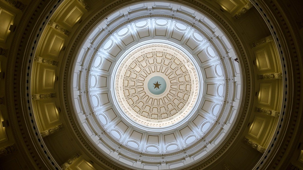 The Texas State Capitol building under a clear sky.