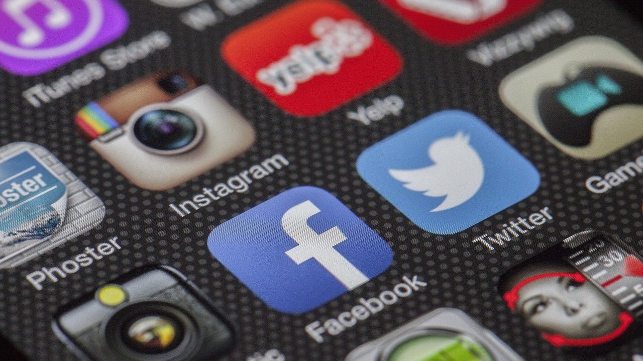 A smartphone displaying social media apps on its screen.
