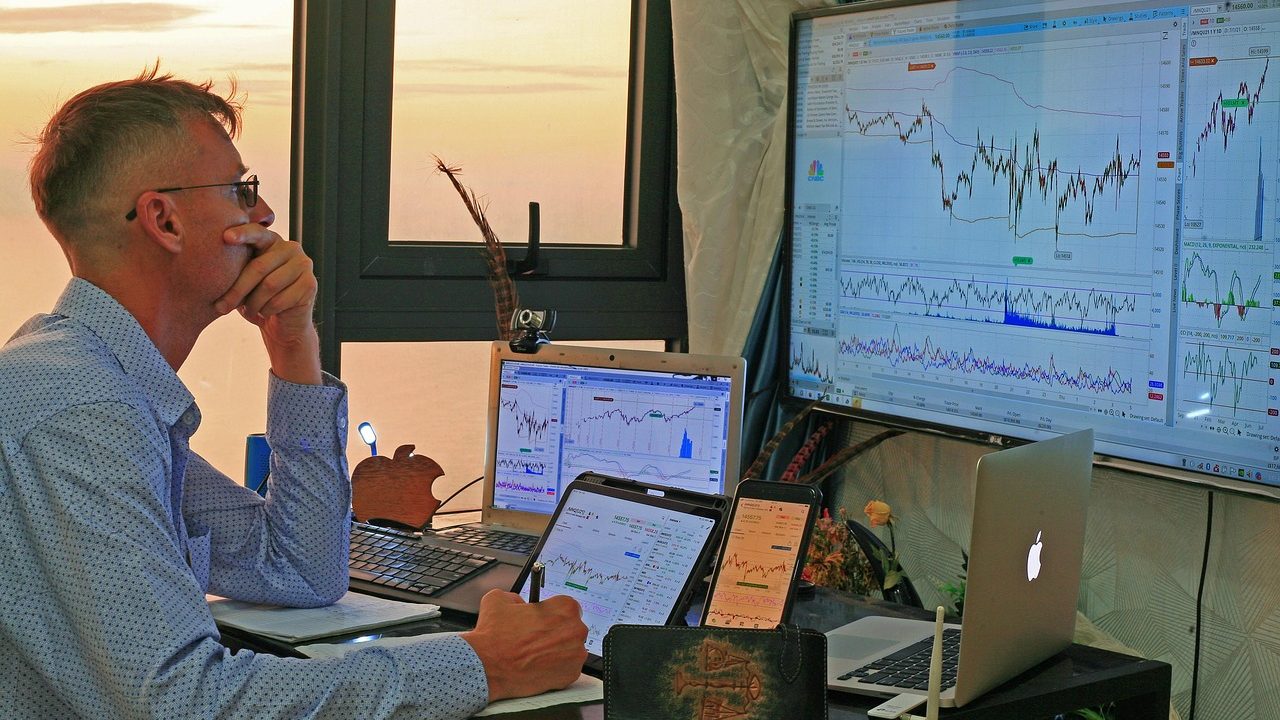A financial chart showing steep market growth curves on a trading screen.