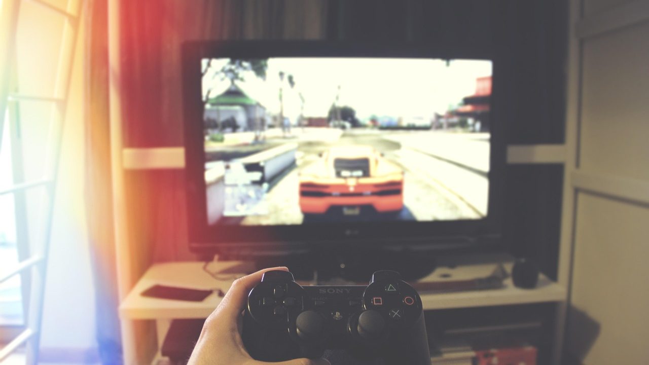 A game controller rests on a surface under soft lighting.