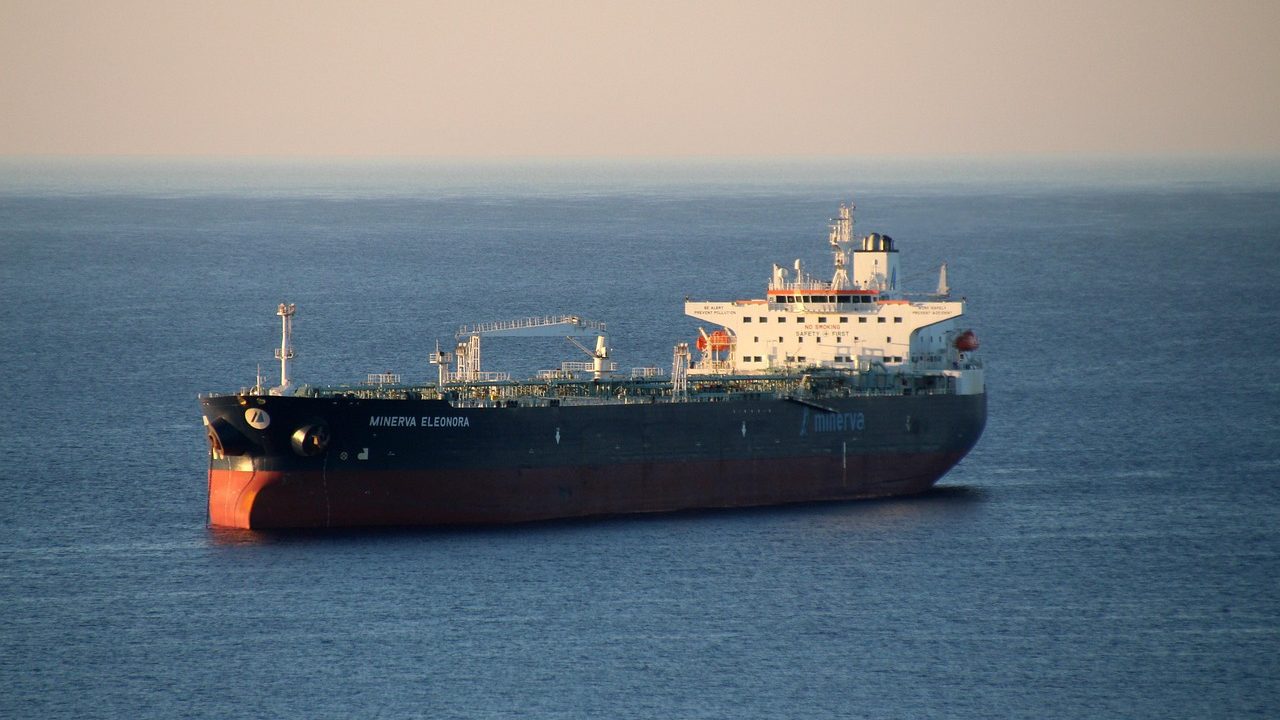 A large oil tanker vessel sailing through open sea waters.