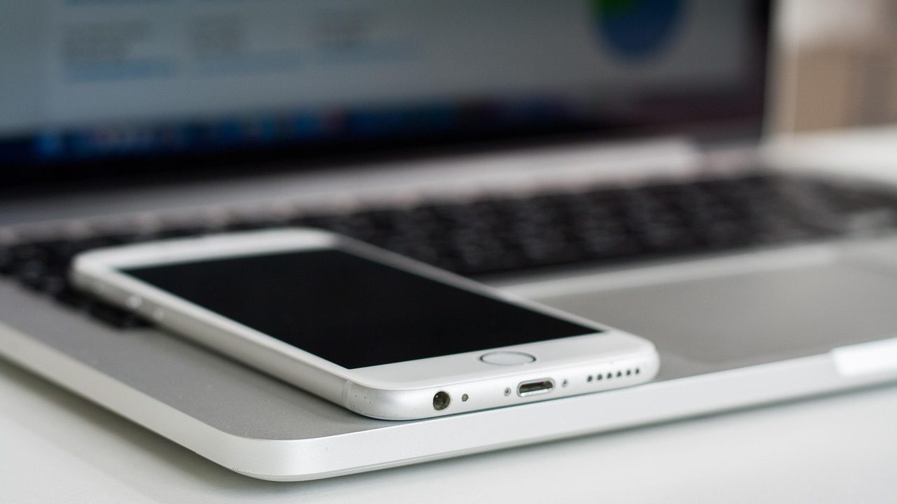 A close-up of a smartphone screen glowing with an application interface.