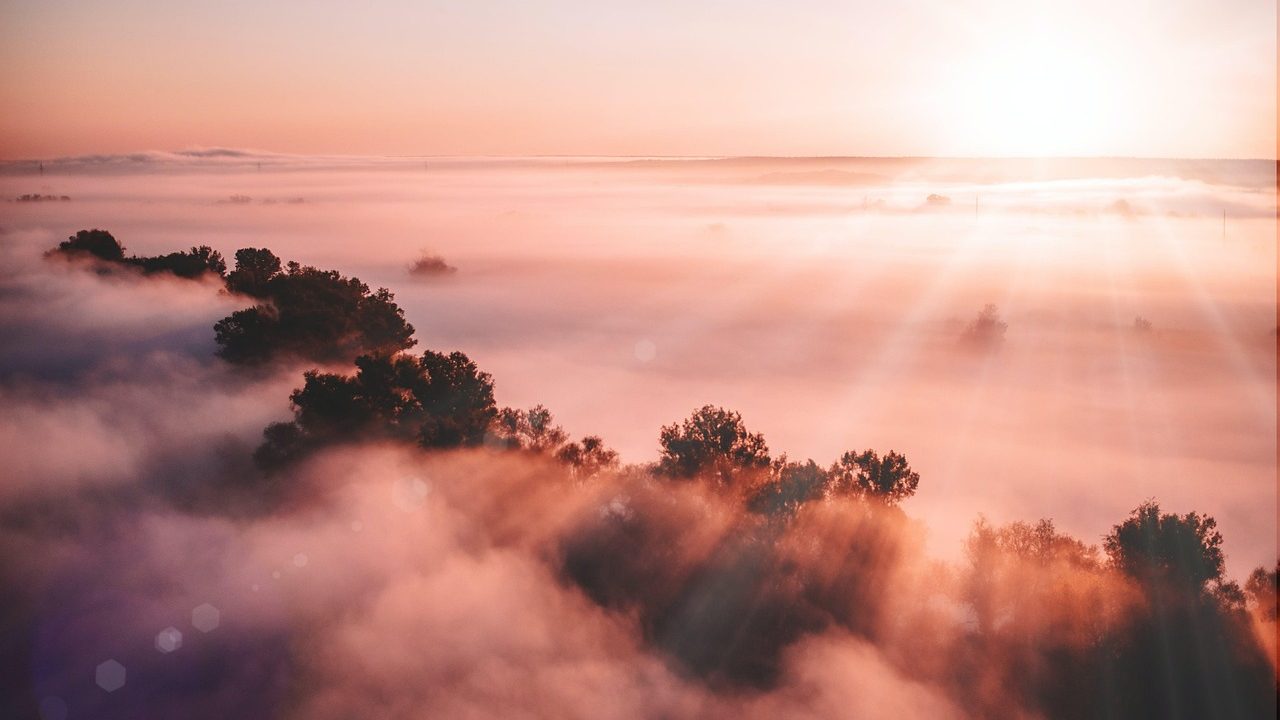 Morning marine layer over a Southern California coastline at dawn.