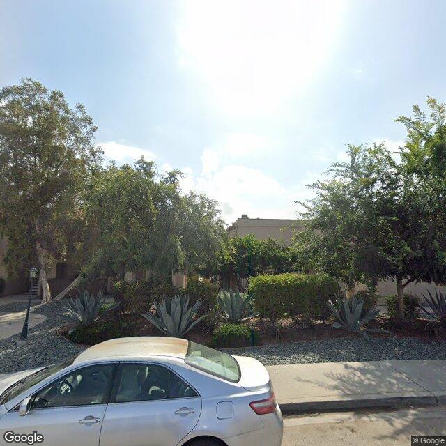 A modest residential street in Winter Gardens, Lakeside, California with single-family homes and open sky.