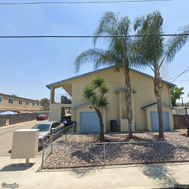 Semi-rural suburban street in Lakeside, California with spacious lots and detached garage homes.